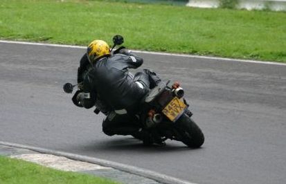 mike of magnolia protocol midlands rock covers band riding triumph tiger round cadwell park
